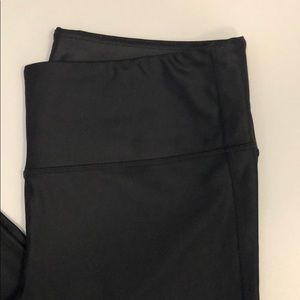 Shiny Athleta workout leggings.